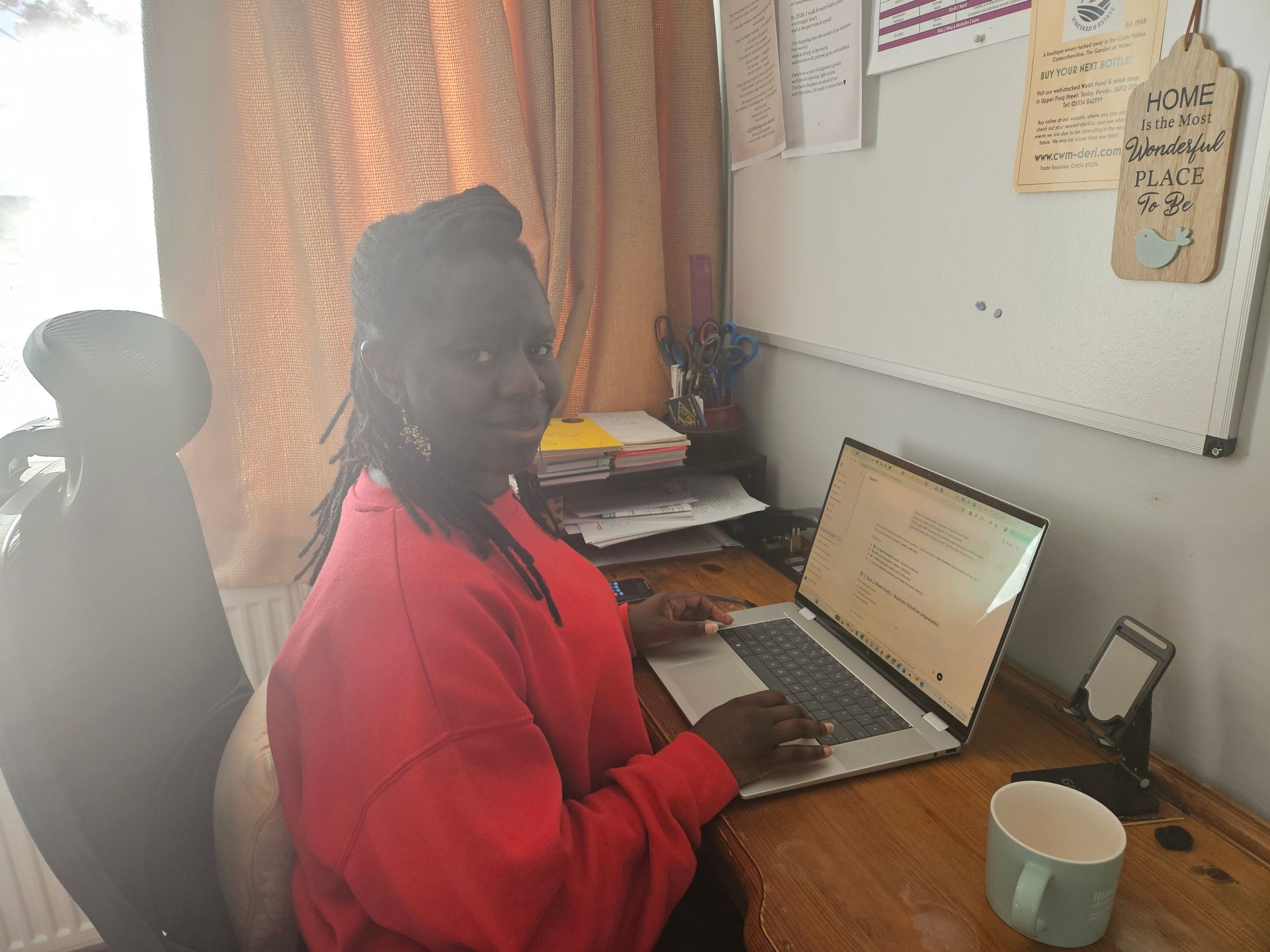 Isamba working at desk as a Virtual Assistant