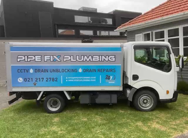 White plumbing truck with logo 
