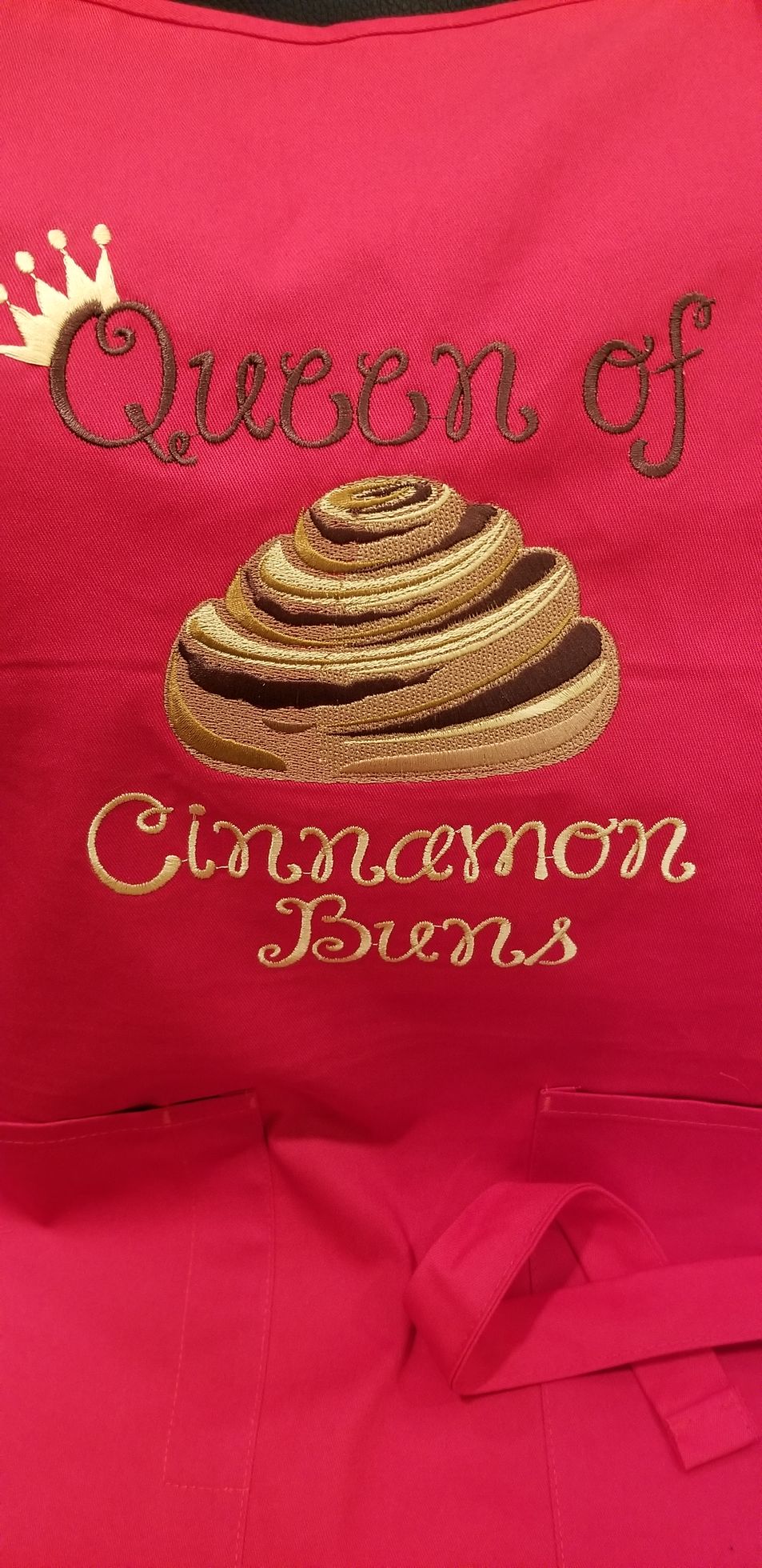 Red apron embroidered with 