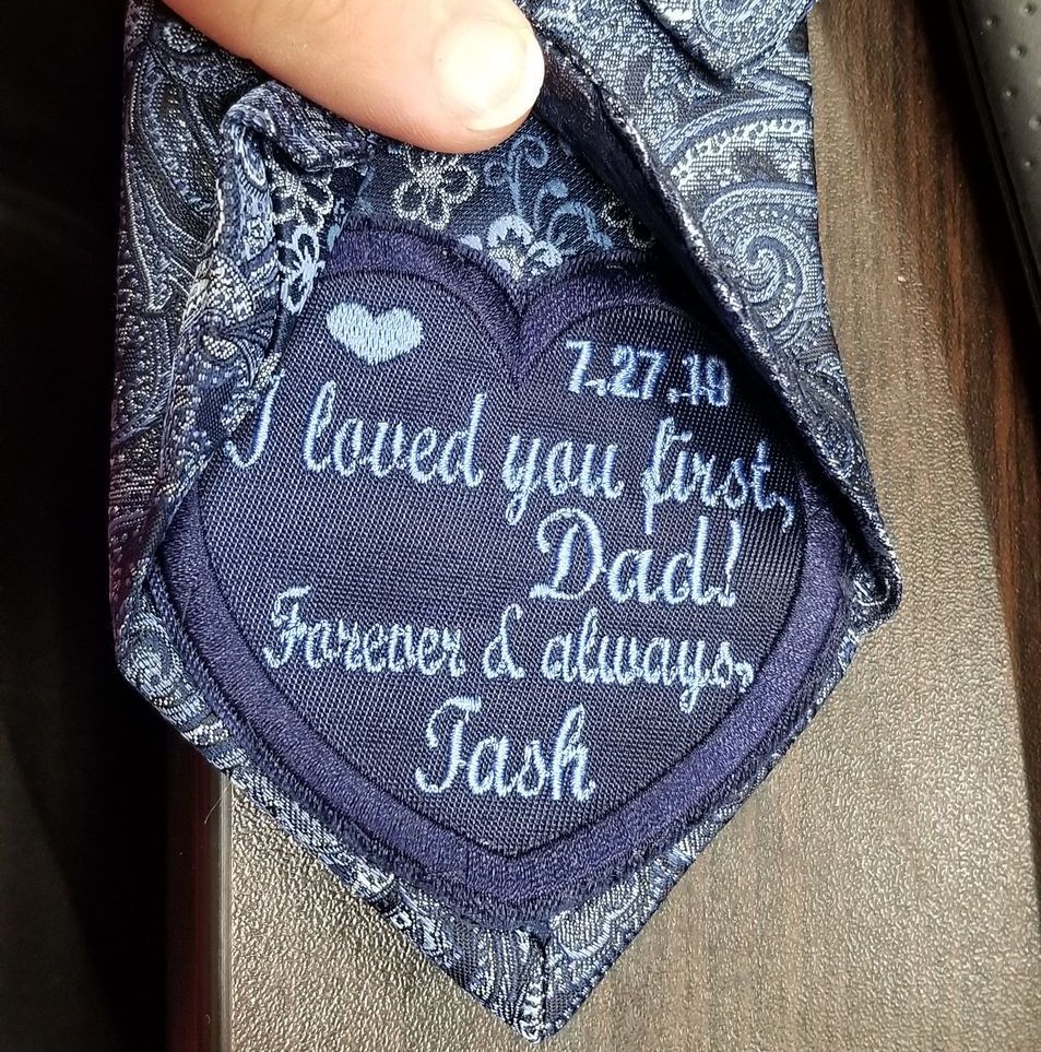 Navy blue tie with embroidered message to