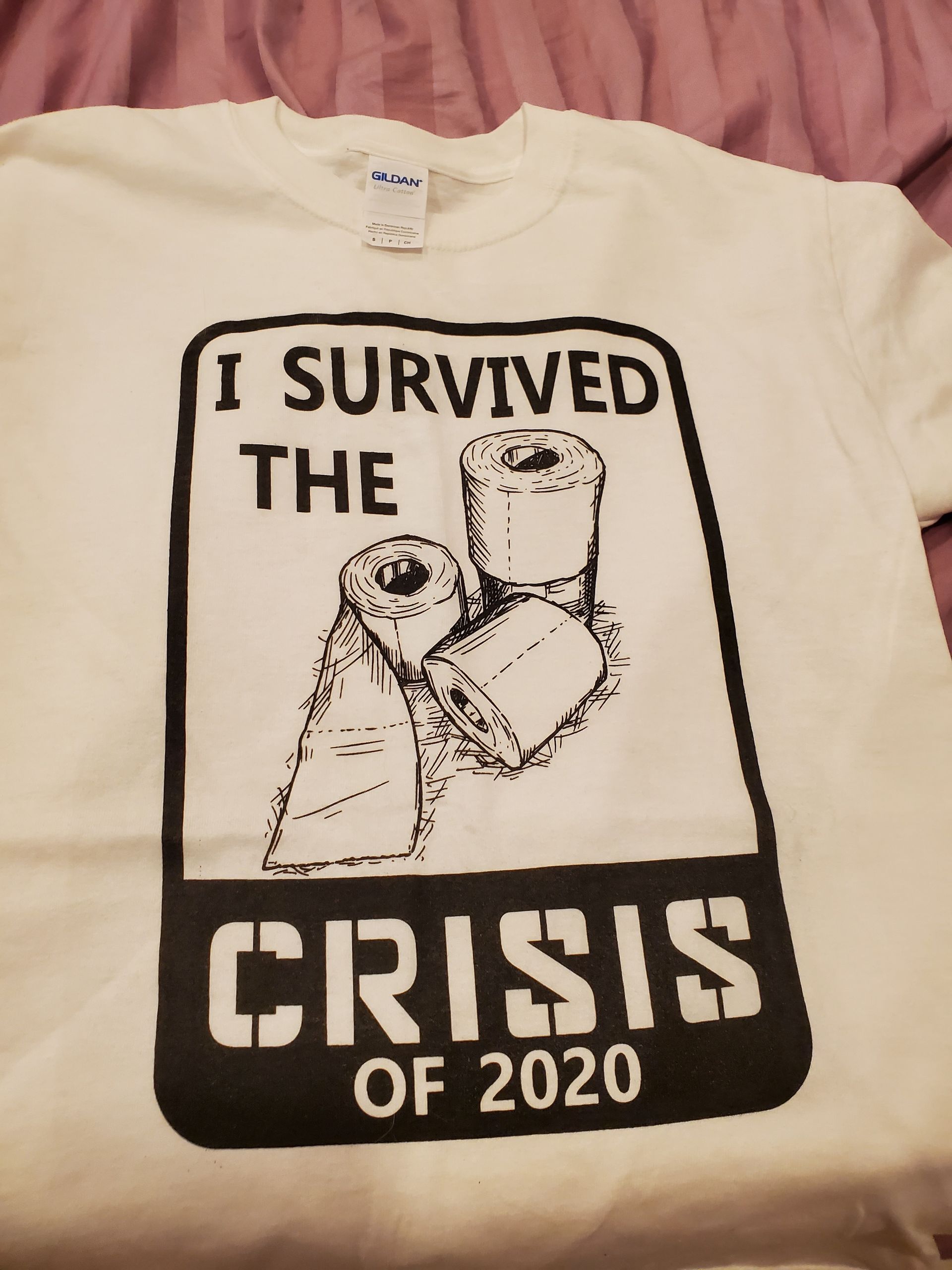 White t-shirt with black text and image. Reads