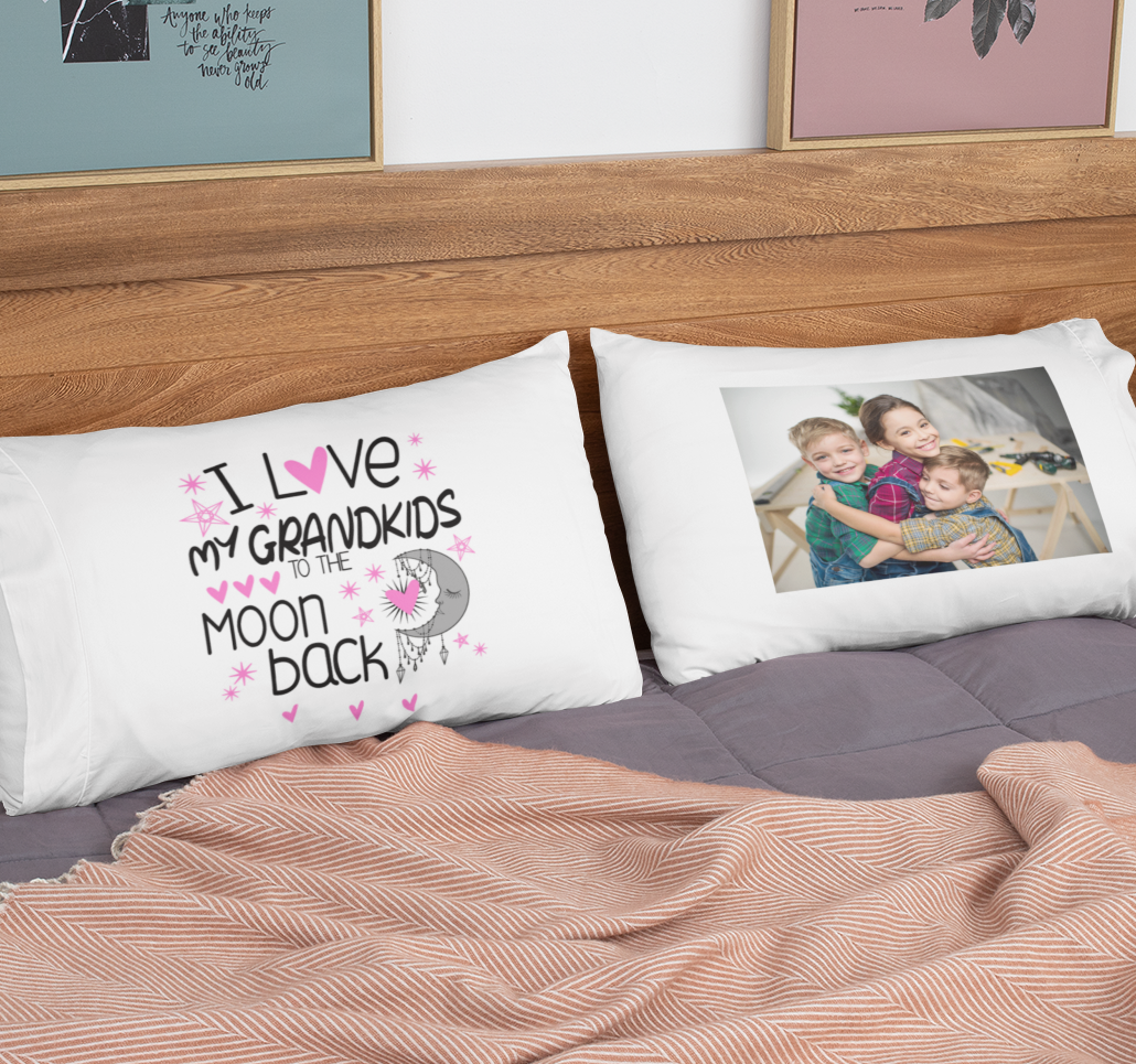 Two white pillows on a bed; one is