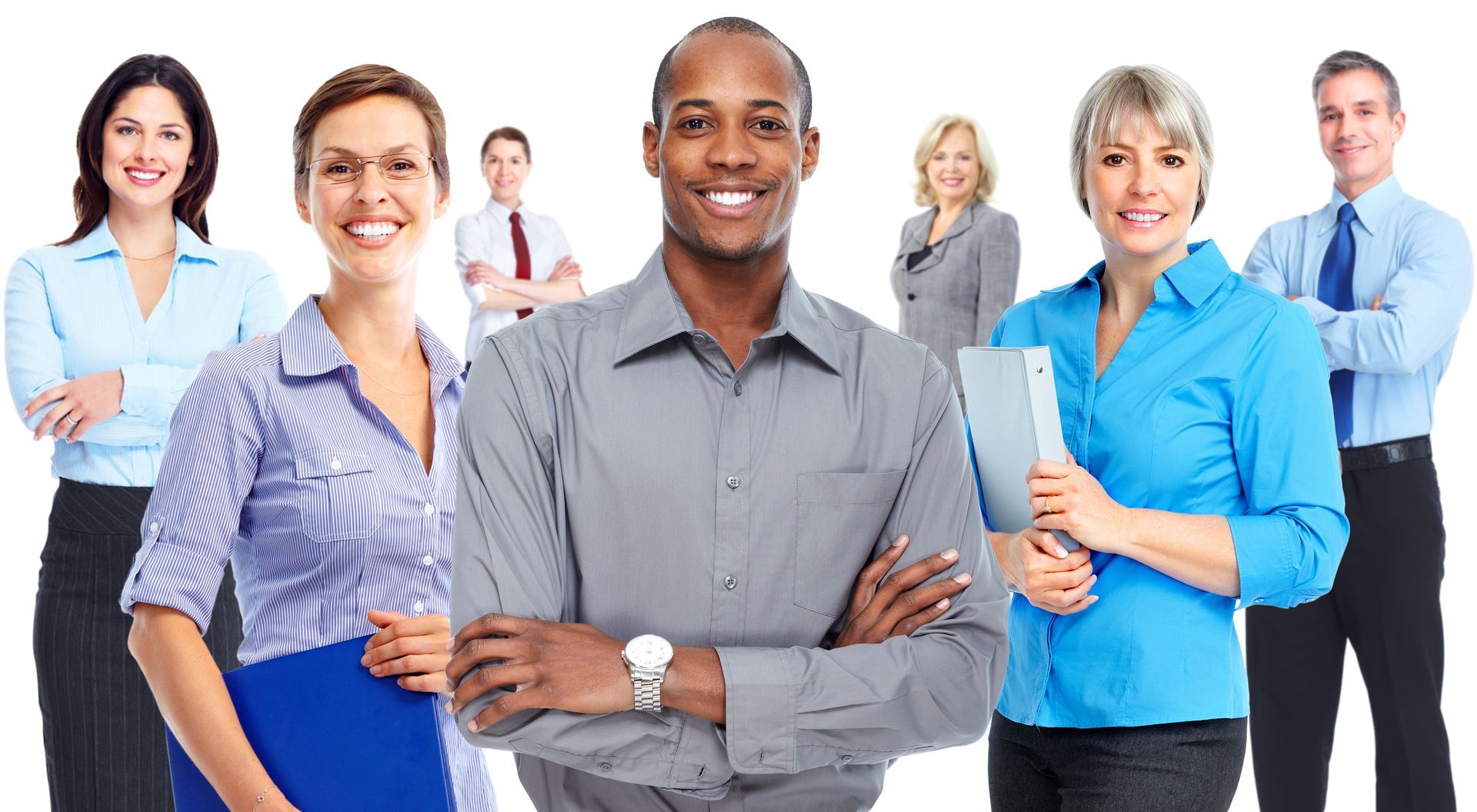 Group of smiling office workers, diverse in appearance, standing together indoors.