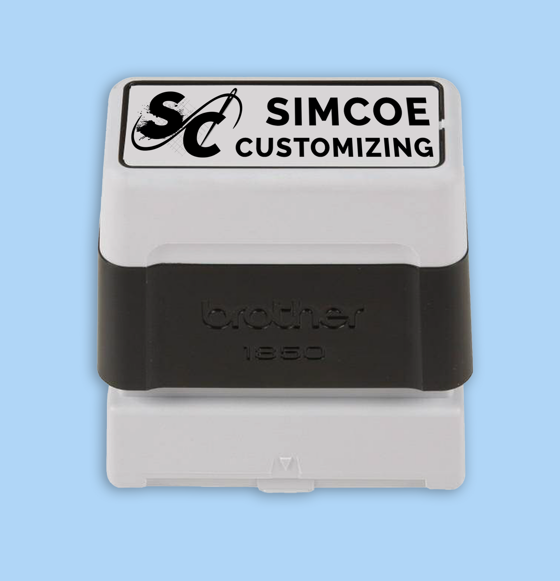 Self-inking stamp for Simcoe Customizing. White and black, with text and logo.