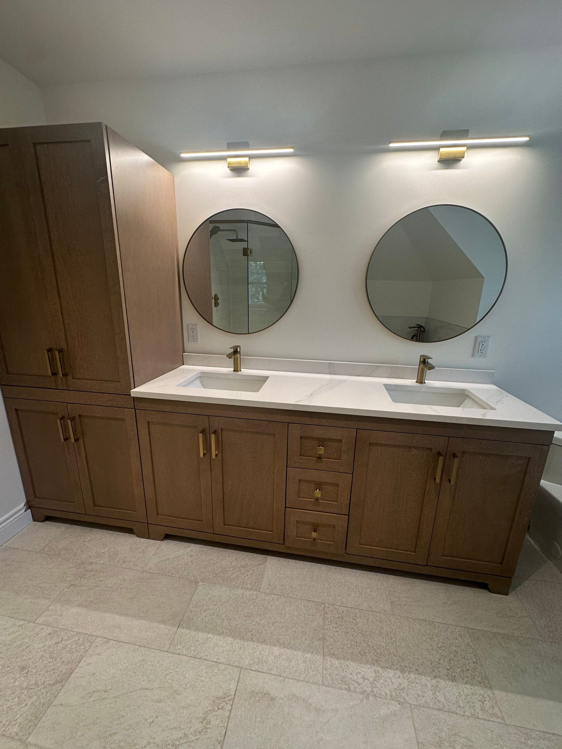 A bathroom with two sinks and two mirrors.