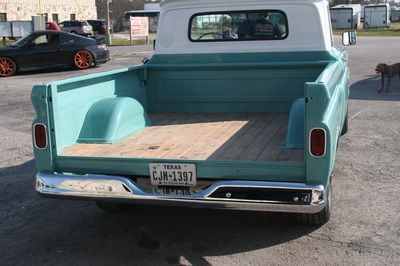 A texas license plate is on the back of a truck