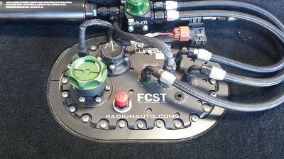 A fuel pump with a red button 