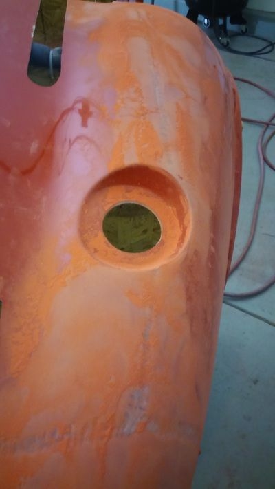 A close up of an orange object with a hole in it