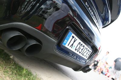 A black car with a license plate that says tx-c031723