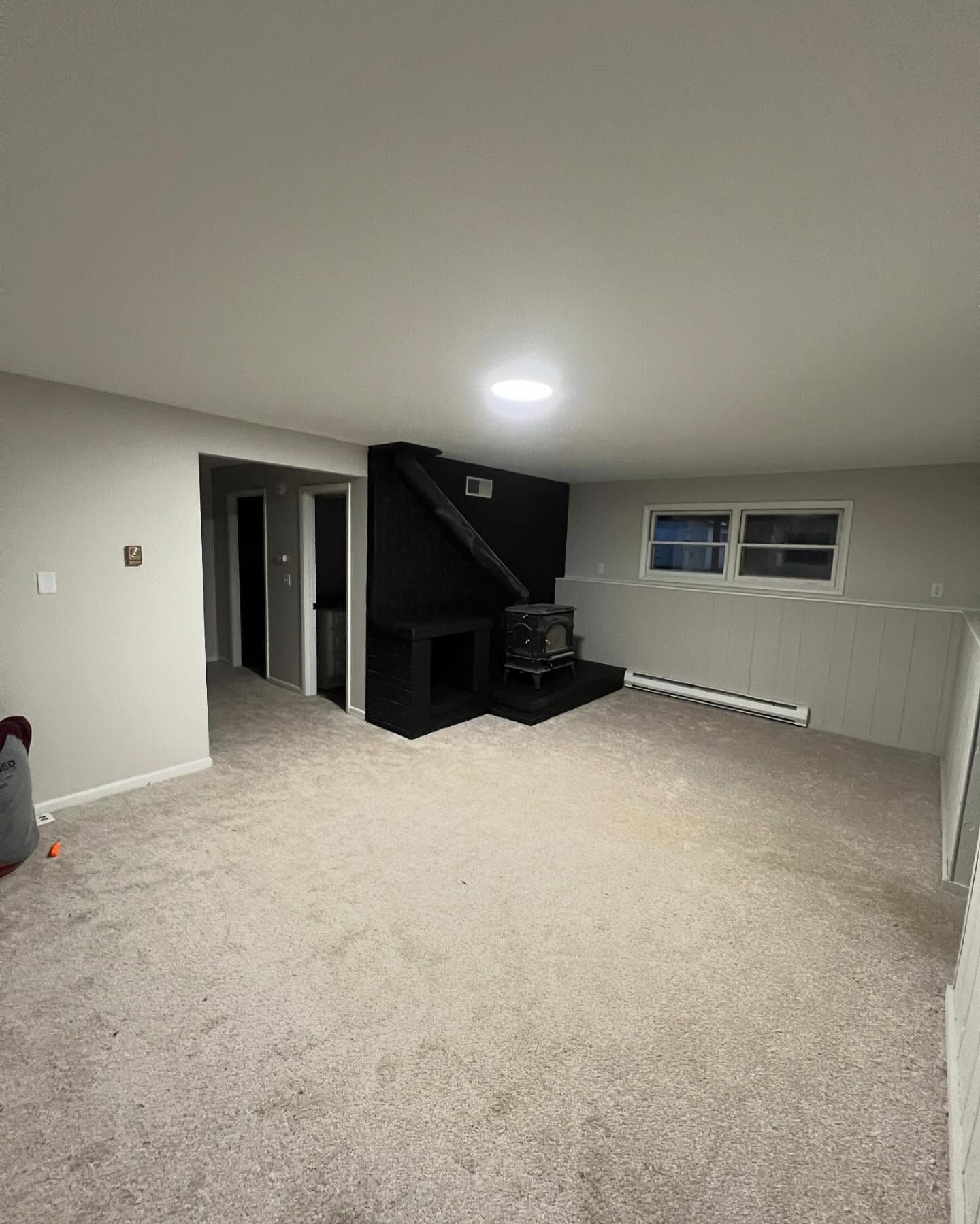 There is a fireplace in the middle of the room.