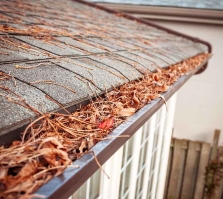 Eavestrough clogged with leaves