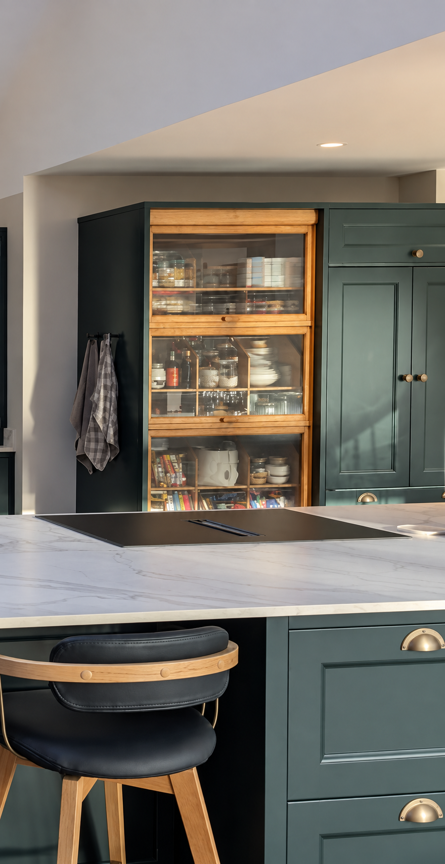 Professionally resprayed kitchen cabinetry with a smooth custom colour finish around a glazed storage unit
