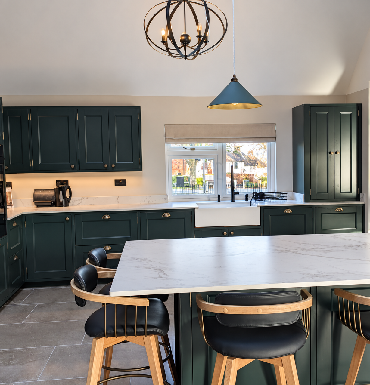 Completed kitchen respray showing professionally sprayed cabinets in a deep custom colour