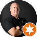 a man in a black shirt is standing in a circle with his arms crossed for google reviews profile