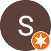 A brown circle with the letter s and an orange star in it.