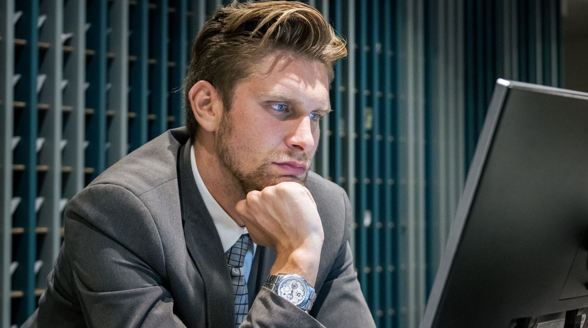 man looking at monitor