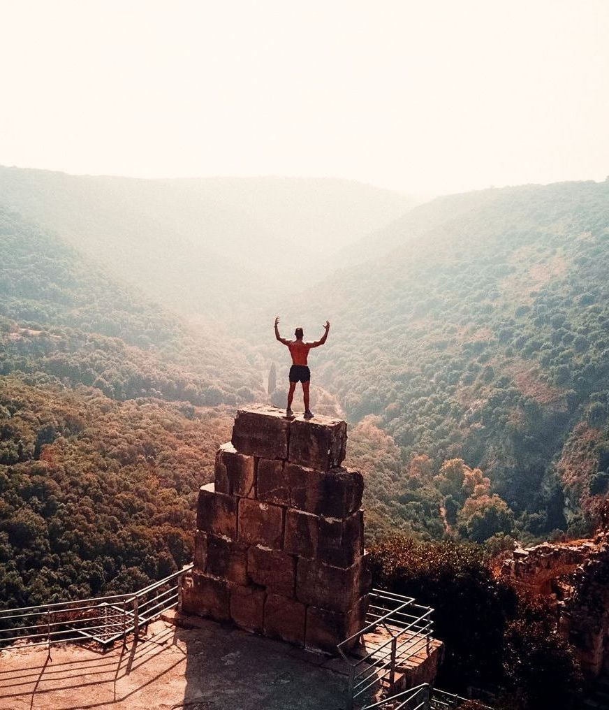 man standing on rocks