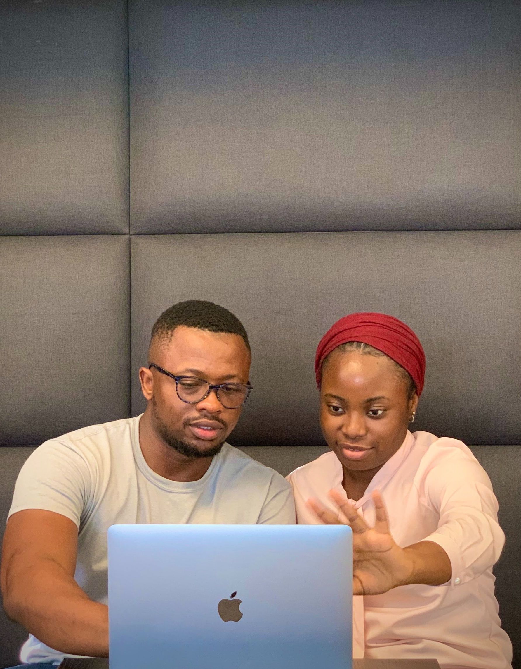 2 people on a laptop