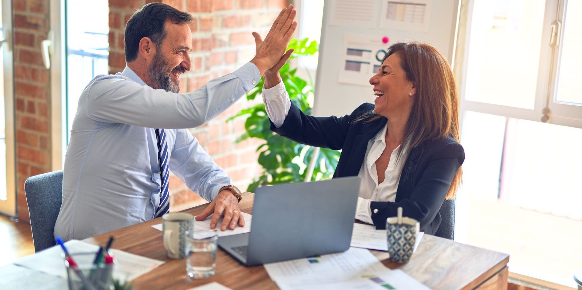 high five at a business meeting