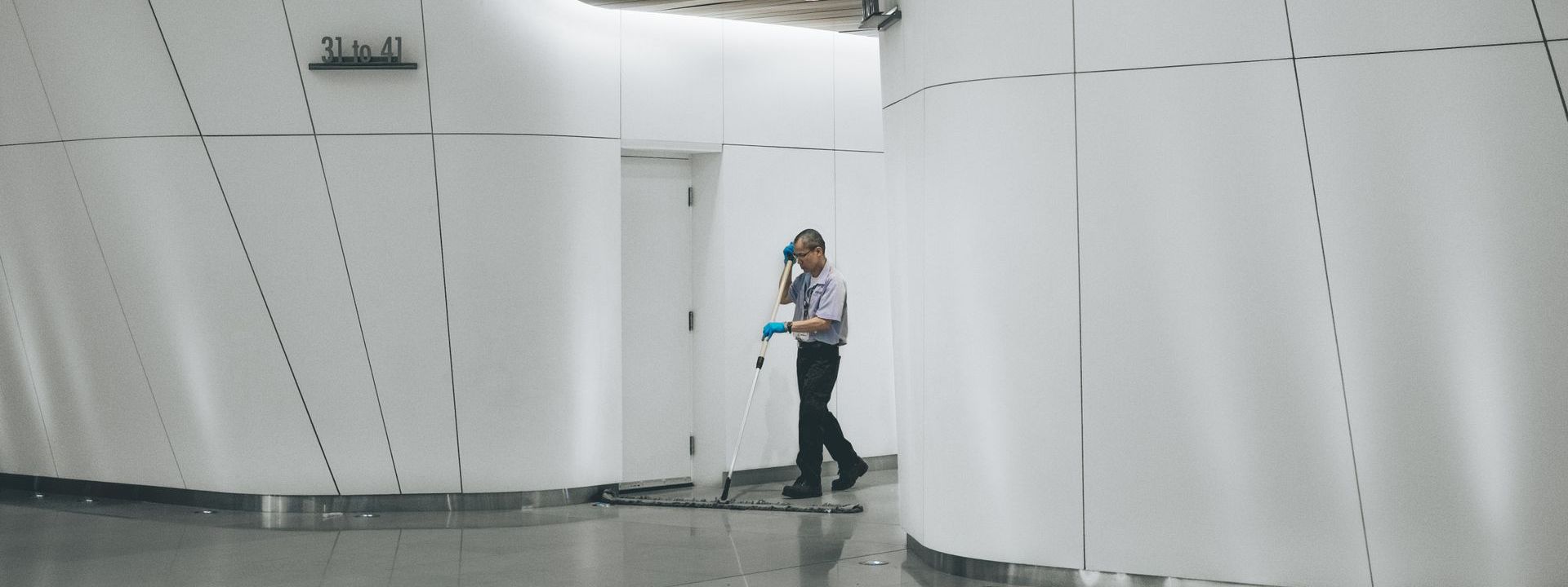 man cleaning floor