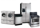 Set of stainless steel home appliances: washer and dryer, dishwasher, refrigerator, and oven.