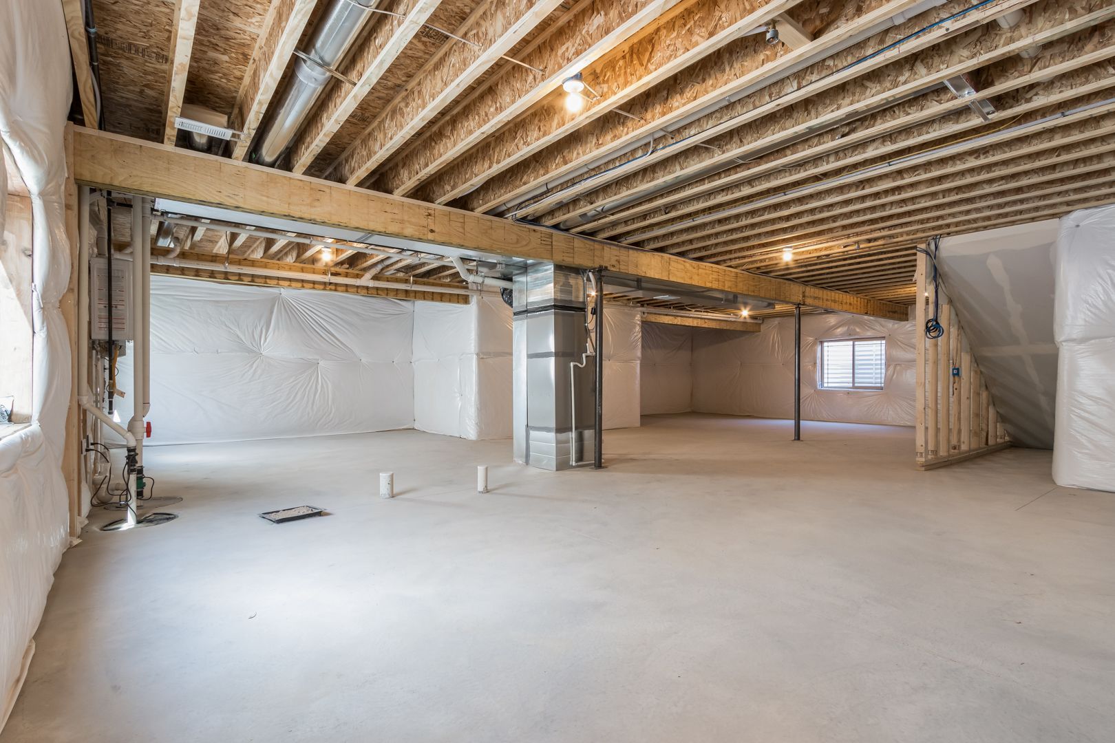 An empty basement in a house under construction.