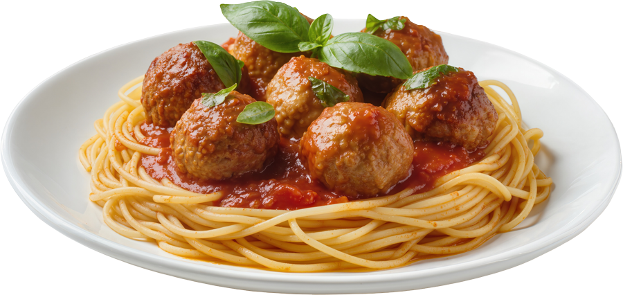 Plate of spaghetti topped with meatballs, tomato sauce, and basil leaves