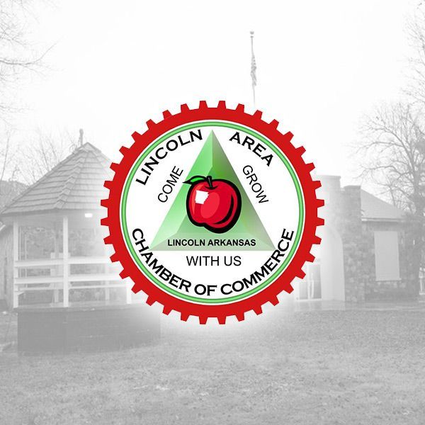 Logo of the Lincoln Area Chamber of Commerce with a red apple inside a green triangle, set against a blurry park gazebo.