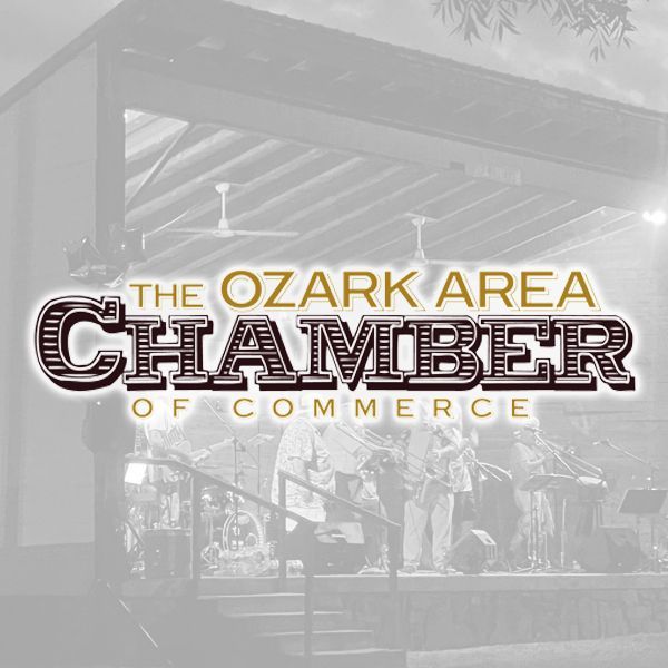 The Ozark Area Chamber of Commerce logo layered over a desaturated photo of a musical performance on an outdoor stage.