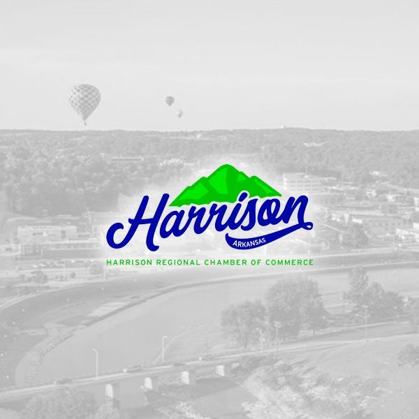 The Harrison Regional Chamber of Commerce logo with a green mountain icon over the blue text, set on a faded aerial view.