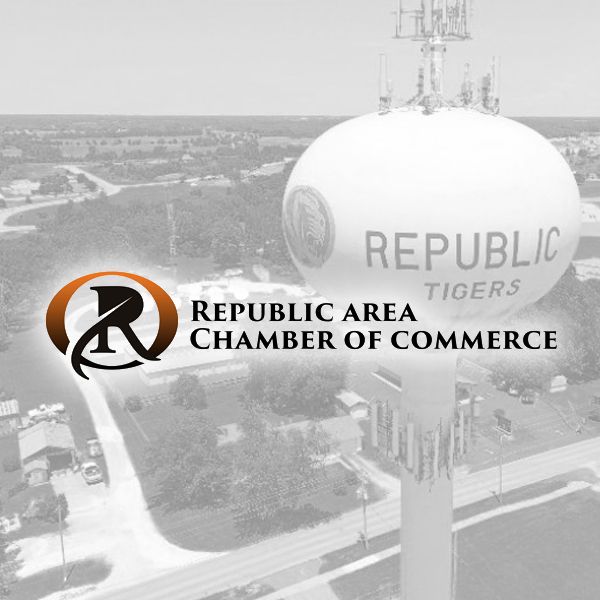Logo for the Republic Area Chamber of Commerce over a faded aerial view of a Republic Tigers water tower.