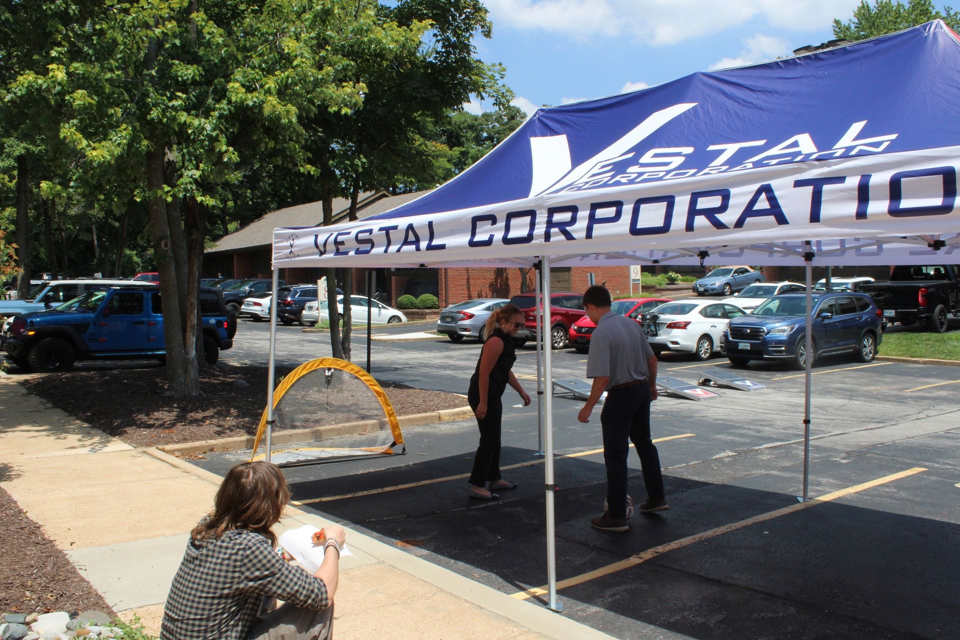 Vestal Team putting together Vestal Corporation pop up tent