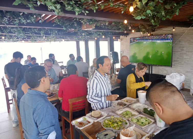 Large social gathering where people are able to watch the world cup.