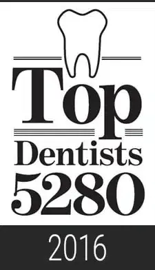 Black and white logo with a tooth on top of 