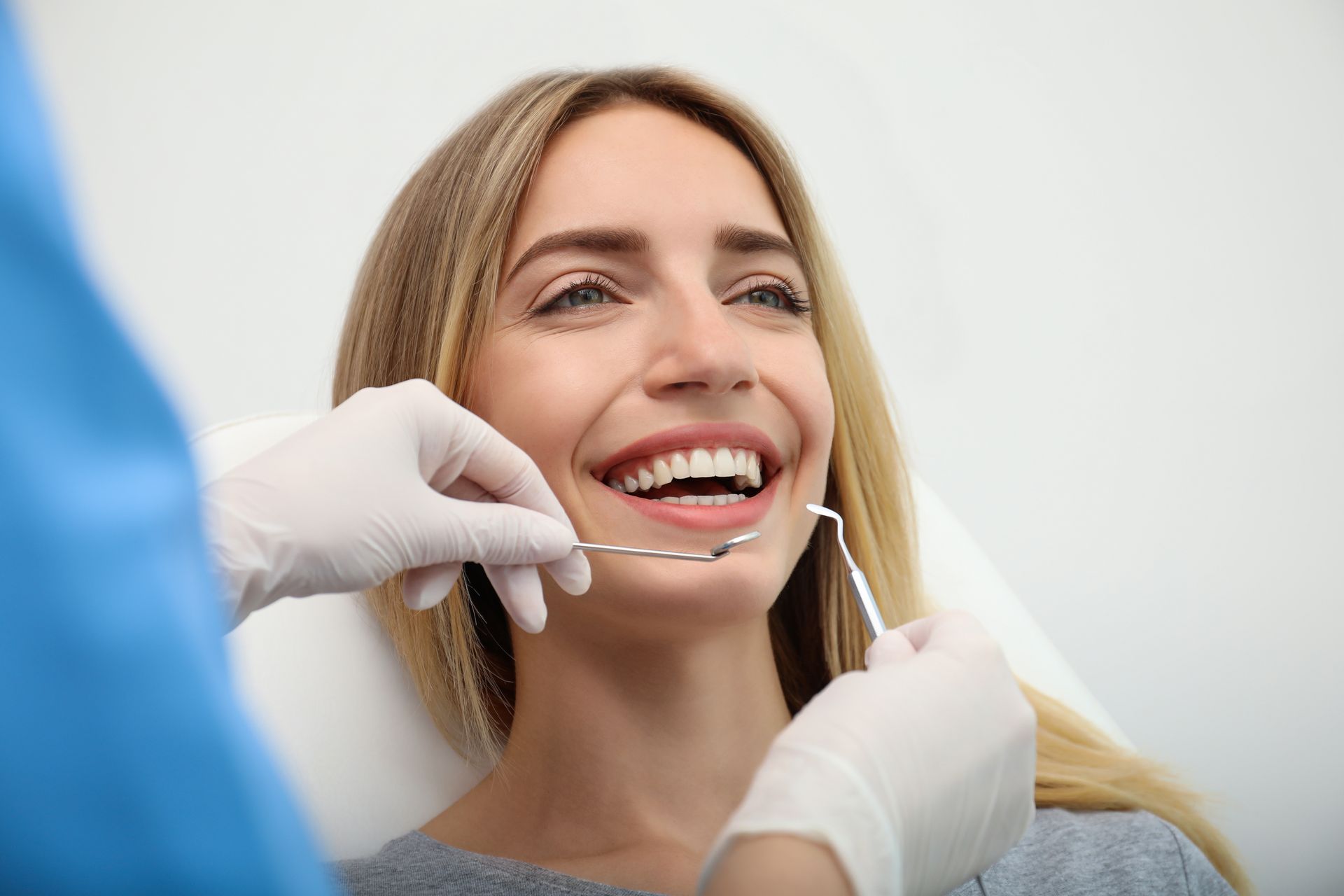 Dental patient receiving routine oral examination and preventive dental care
