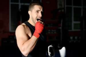 Boxer in Denver inserts mouthguard