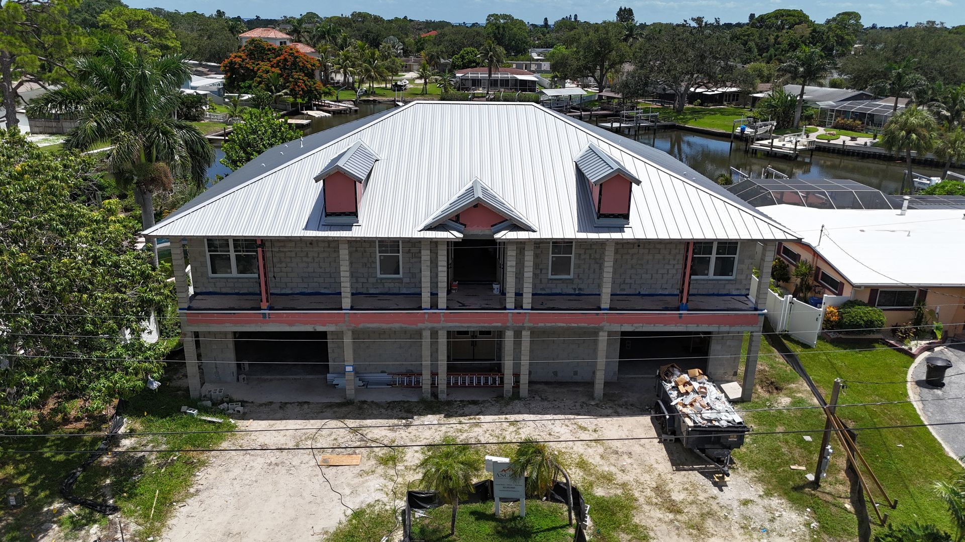 Roofing company Tampa FL line item roof replacement estimate from Red Truck Roofing showing materials, labor, permit fees, dump fees and decking allowance