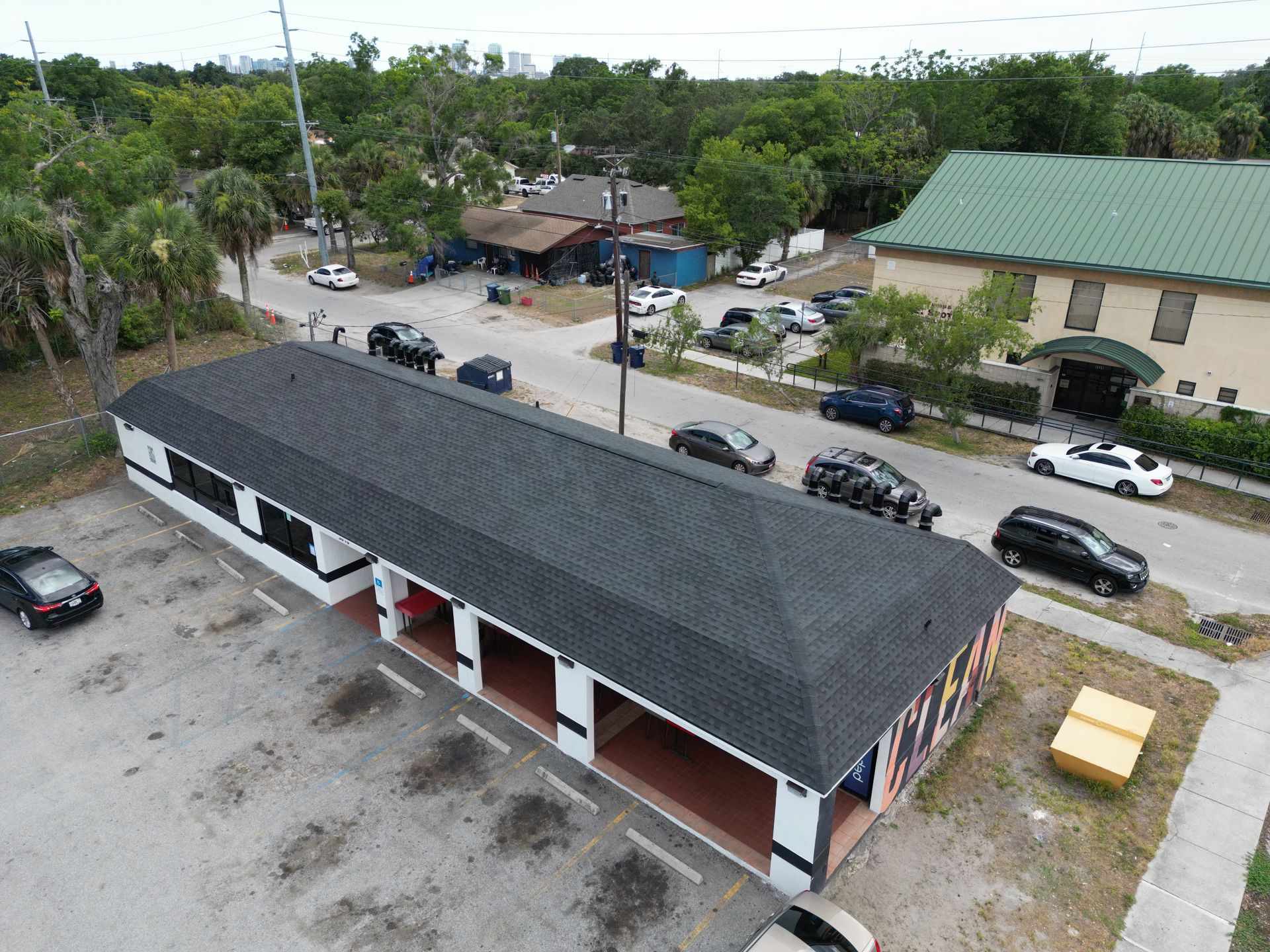 Roofing company Odessa FL line item roof replacement estimate from Red Truck Roofing showing materials, labor, permit fees and decking allowance