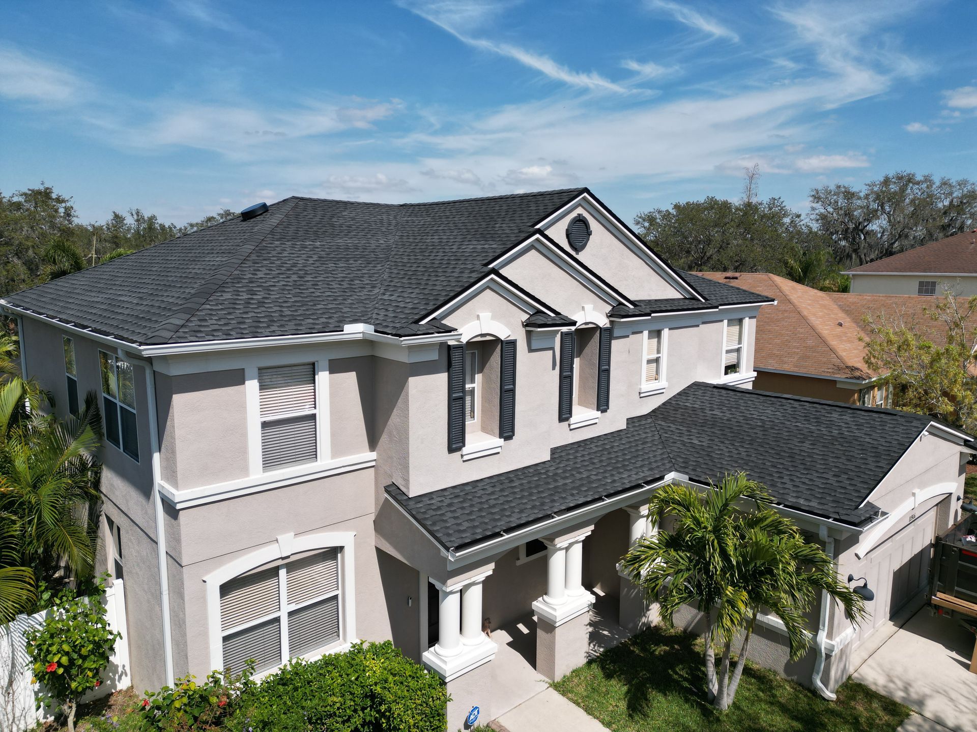 Roofing company Odessa FL line item roof replacement estimate from Red Truck Roofing showing materials, labor, permit fees and decking allowance