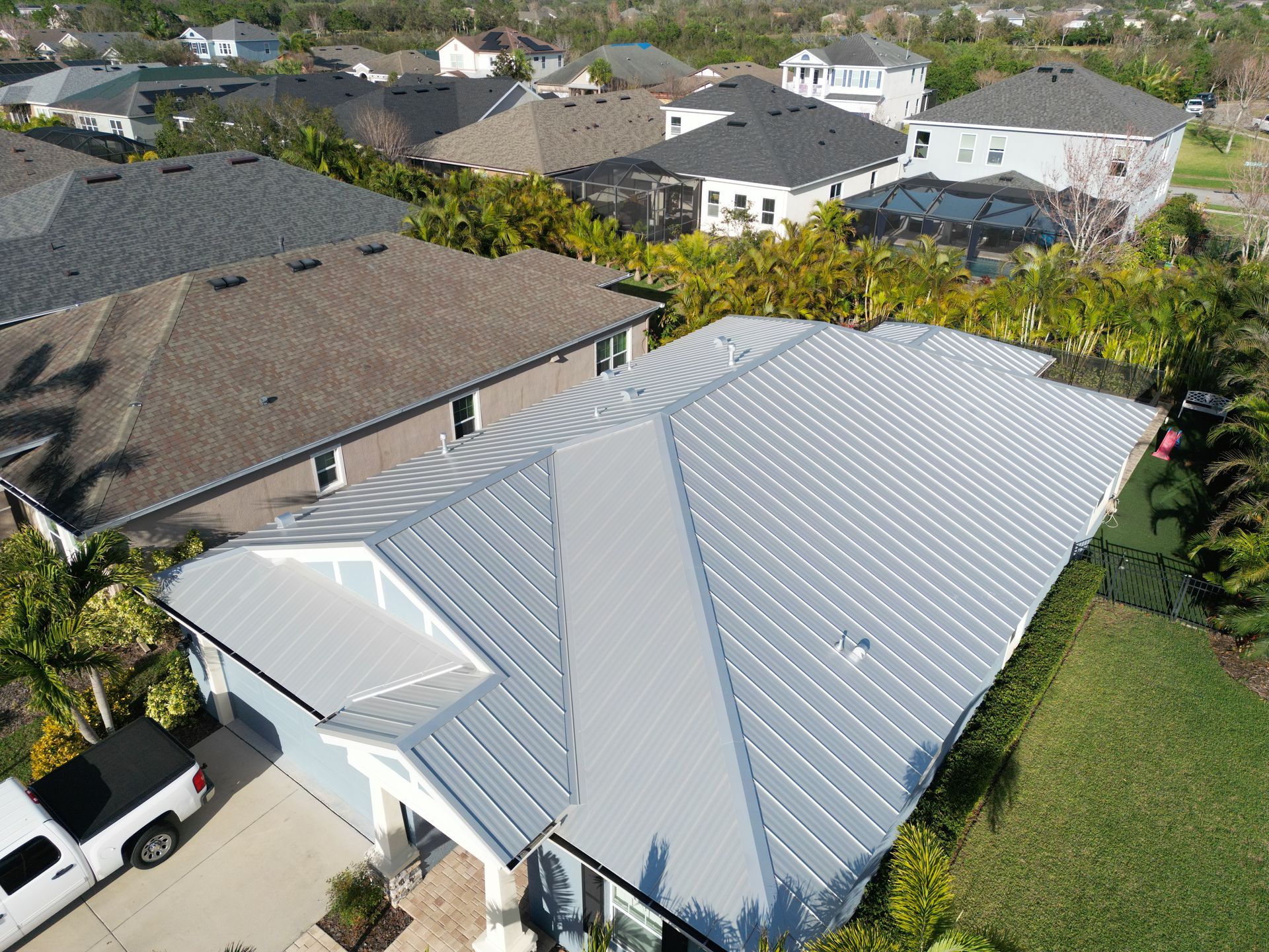 Roofing company Odessa FL line item roof replacement estimate from Red Truck Roofing showing materials, labor, permit fees and decking allowance