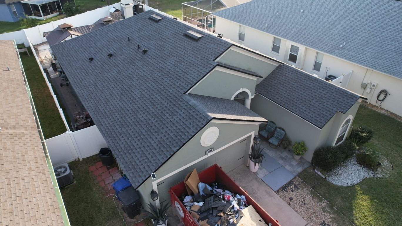 Roofing company Odessa FL line item roof replacement estimate from Red Truck Roofing showing materials, labor, permit fees and decking allowance