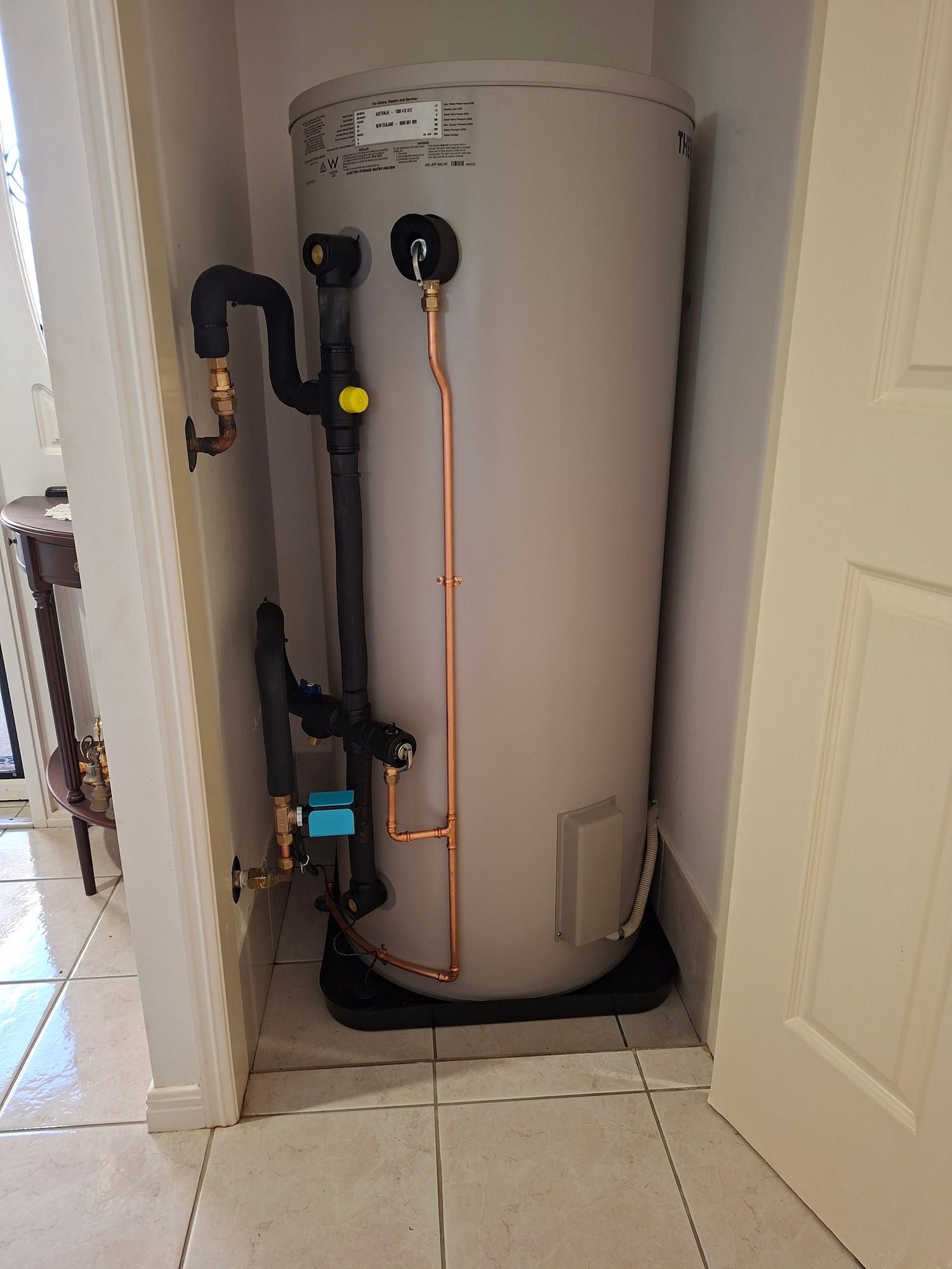 A hot water system inside a cupboard on the Sunshine Coast