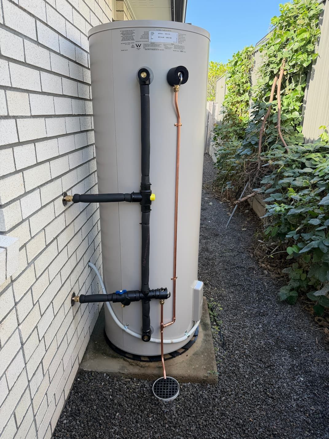 A new hot water system sitting outside on the Sunshine Coast