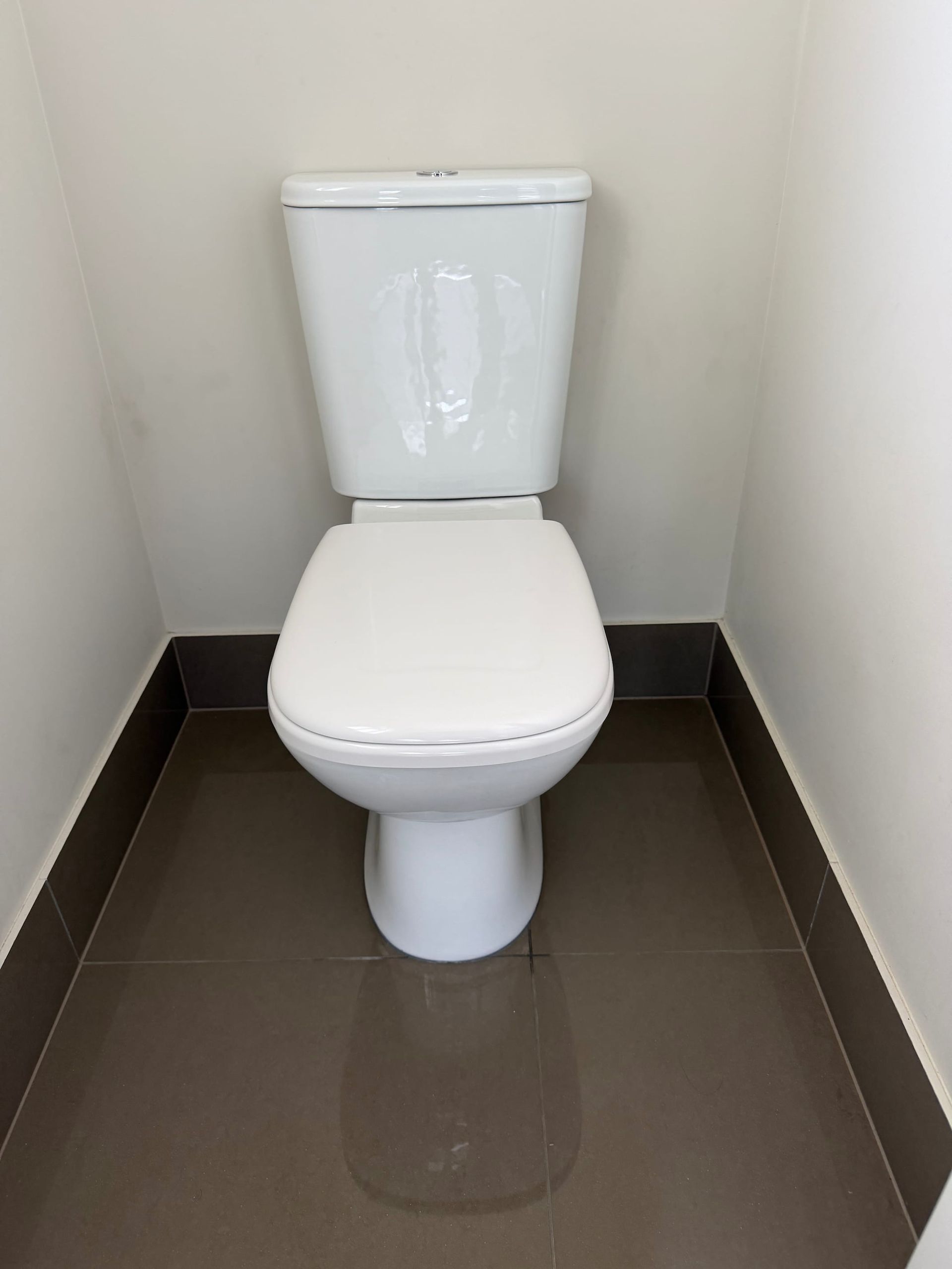 A new toilet installed by a plumber on the Sunshine Coast