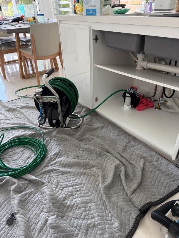 A kitchen sink being cleared on the Sunshine Coast