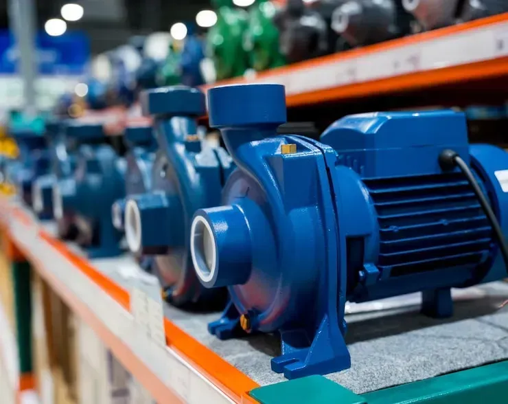 Blue water pumps on a store shelf, showcasing multiple units for sale.
