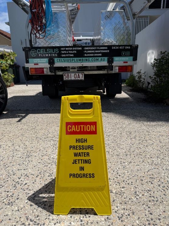 A plumber performing high pressure water jetting on the Sunshine Coast