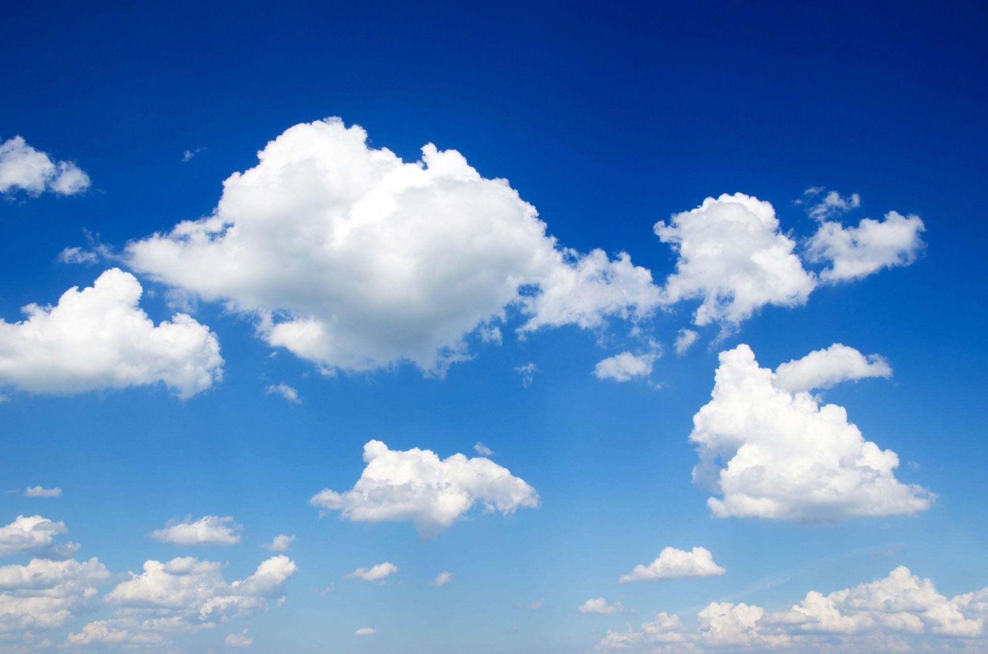 a blue sky with white clouds in it