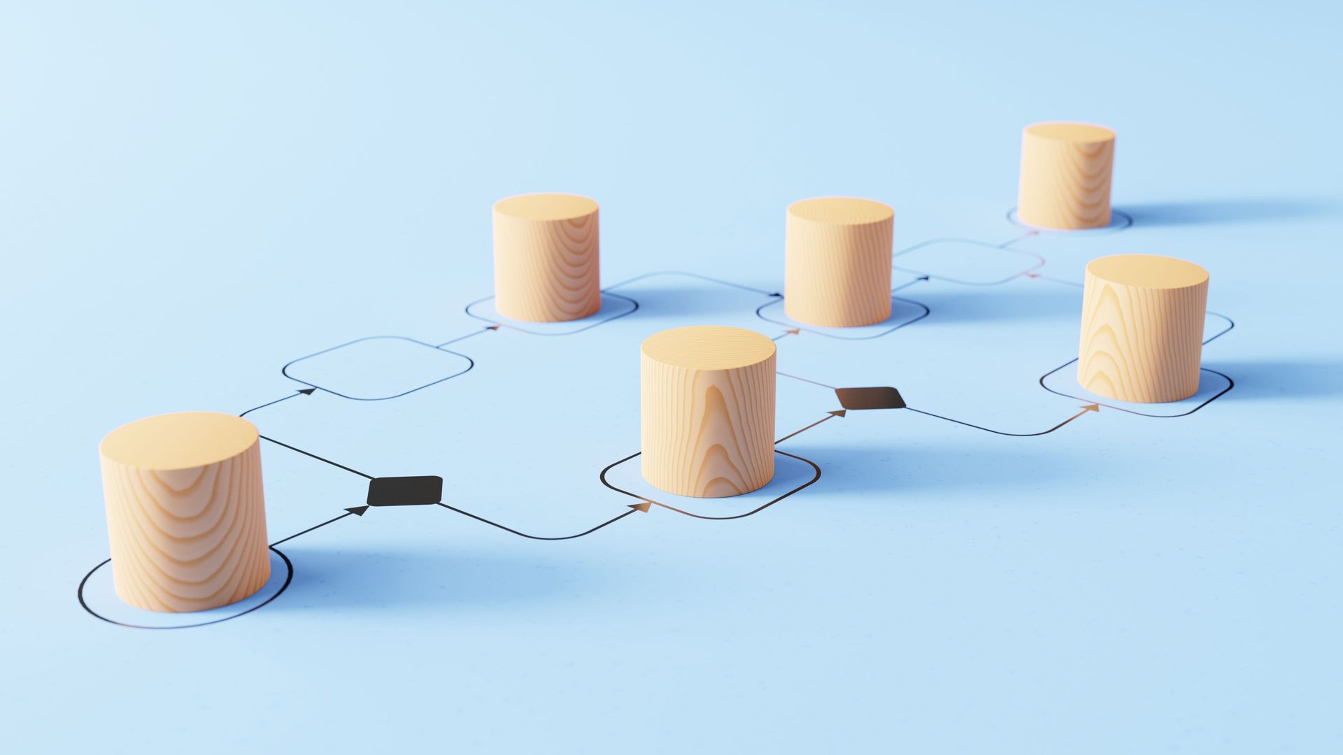 a row of wooden cylinders are connected to each other on a blue surface