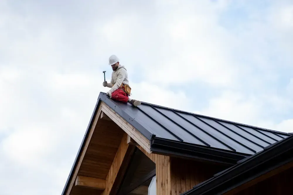 a guy installing roof